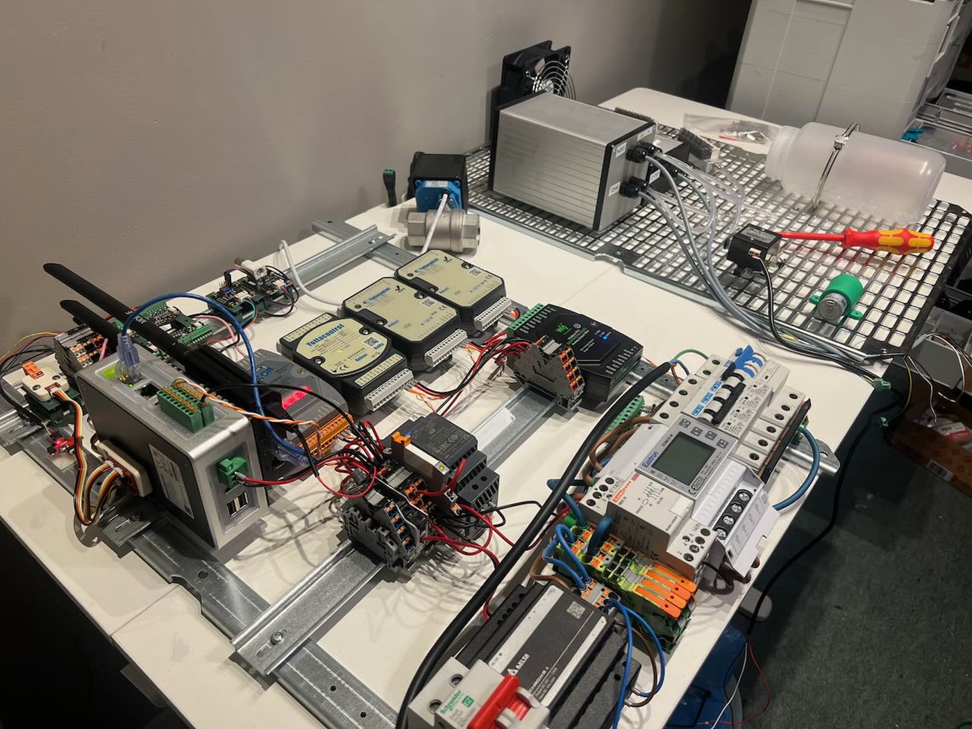 Electrical panel components laid out on a bench